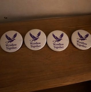 Campaign buttons with logo — customer photo