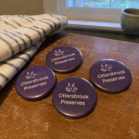 Promotional custom campaign buttons with company logo
